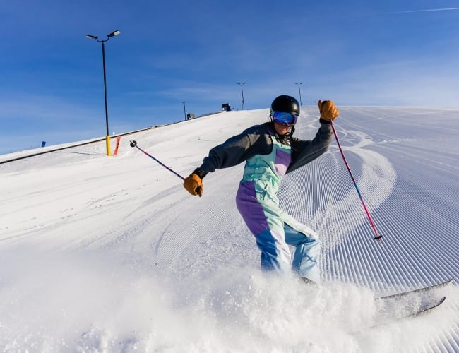 a man downhill skiing