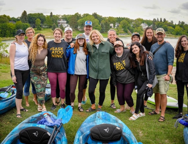 A group of Tourism Saskatoon employees taking a group photo.