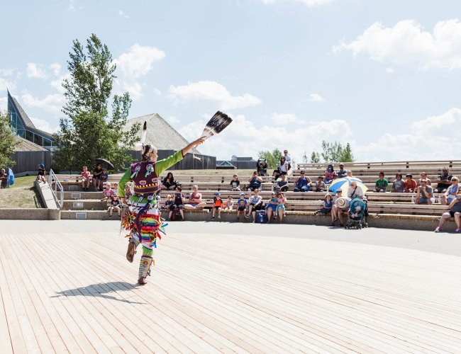 An Indigenous individual performing