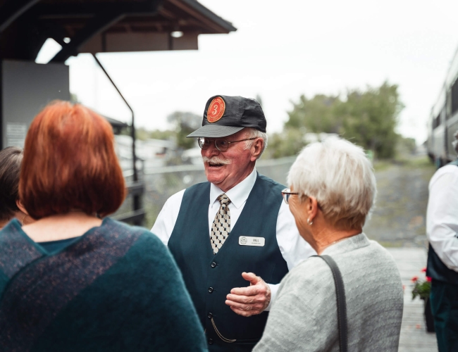 Tour guide speaking to visitors on a tour