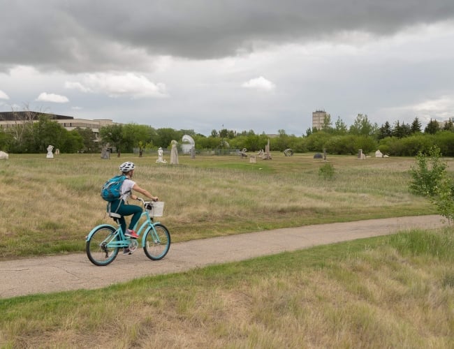 Man riding a bike in a public park