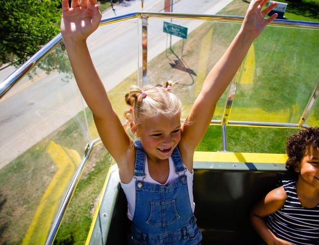 two children on a amusement park ride
