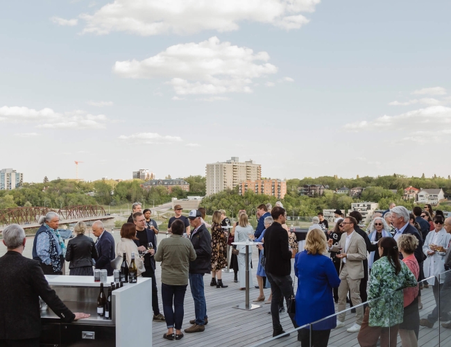 Group of people on a rooftop at a business gathering