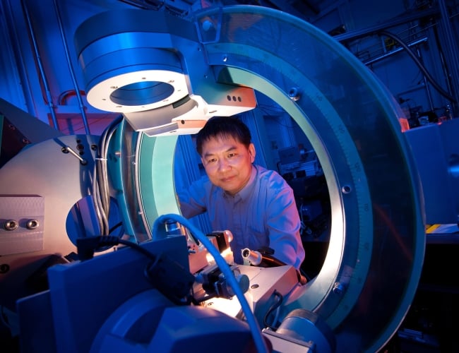 Man looking into machinery