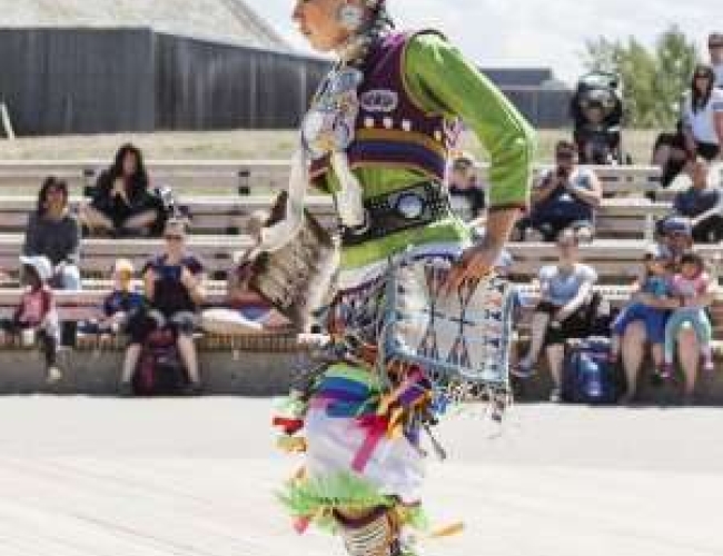 Indigenous woman dancing in traditional clothing