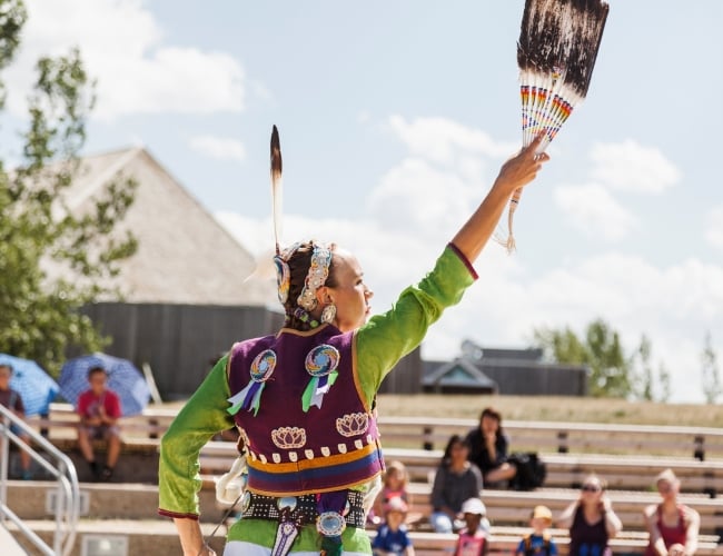 An Indigenous individual performing