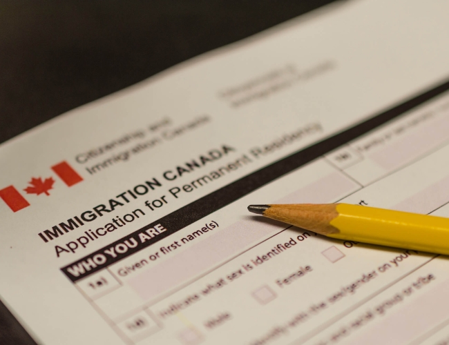 Immigration Canada form with a yellow pencil