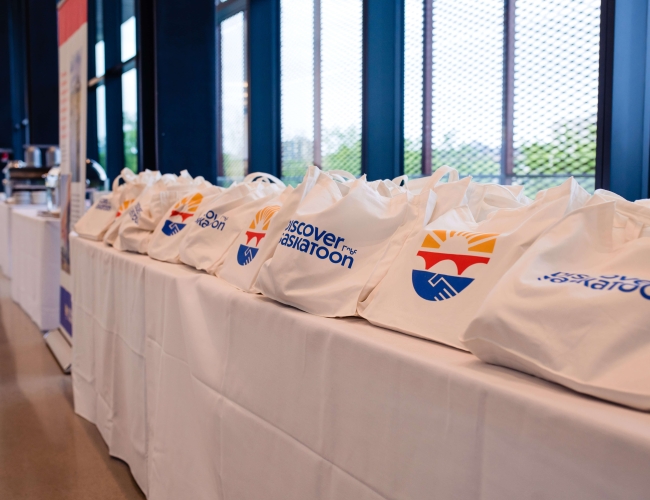 Discover Saskatoon branded bags on a table