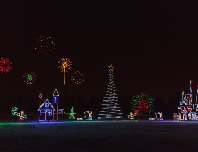 Christmas trees and houses dressed up in holiday lights