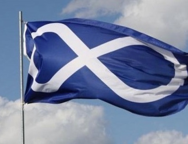 Blue Metis flag with a white figure 8 is flying