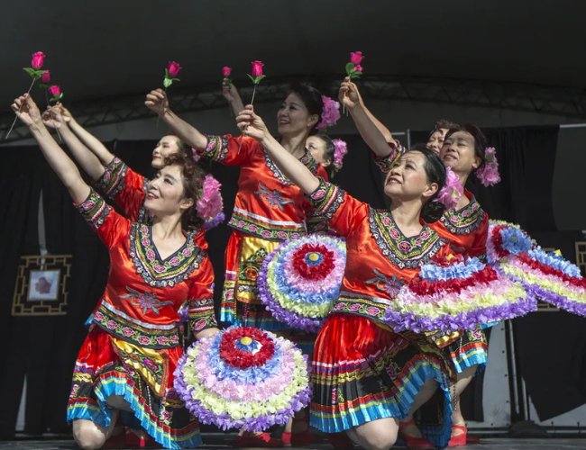Folk fest cultural dancers on stage.