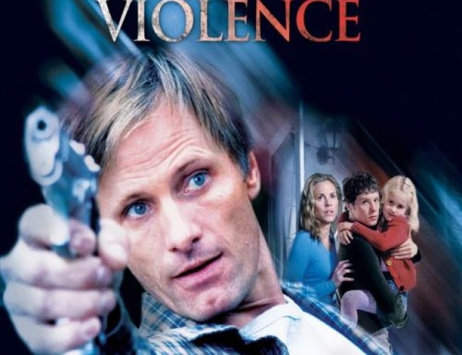 Image from the movie; A History of Violence. Shows the main actor holding a gun on one side and then a woman and a man holding a young girl looking in fear in the far out distance.