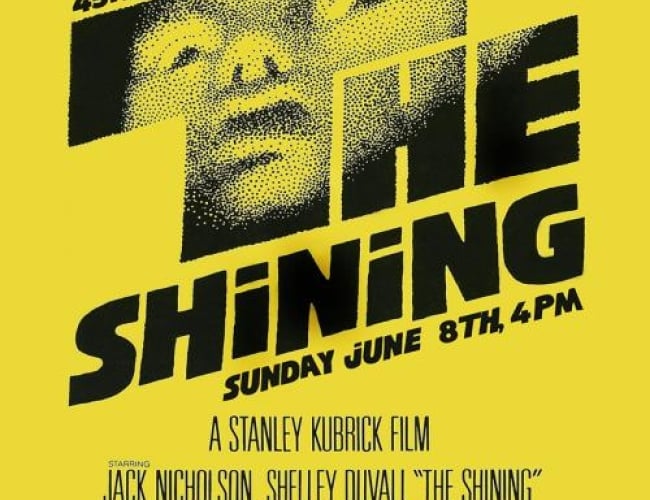 Image from the movie the shining. Shows a person with their head tilted up and eyes wide, looking scary.