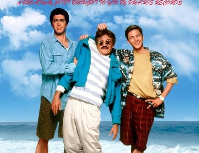 Image of the movie; Weekend at Bernie's. Shows two men holding up a third man in the middle by his hair and shoulders.