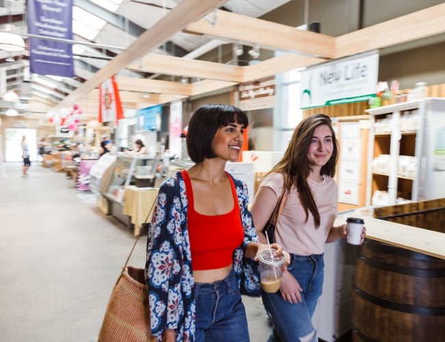 two women shopping in local market