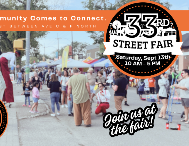 People talking and having fun at the 33rd Street Fair with vendor tents in the background.