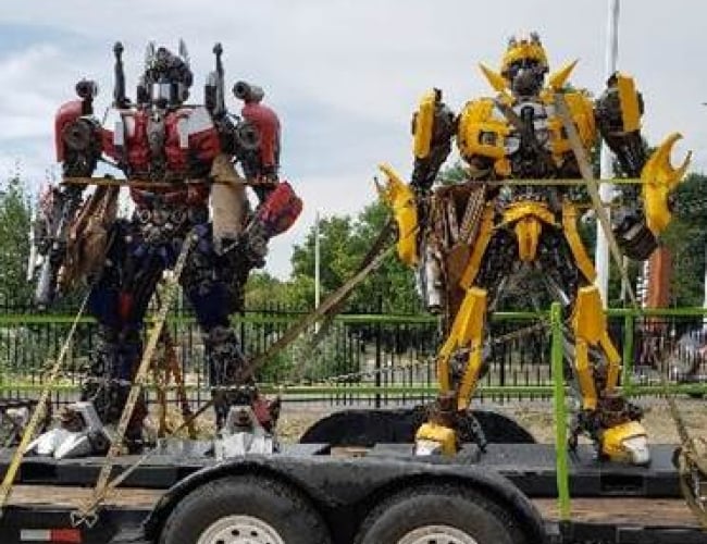 Two transformers on a truck trailer.