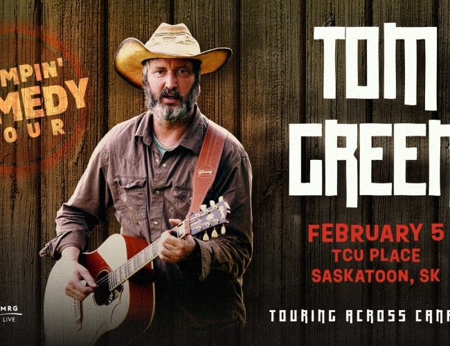 An image of an older man in a cowboy hat holding a guitar.