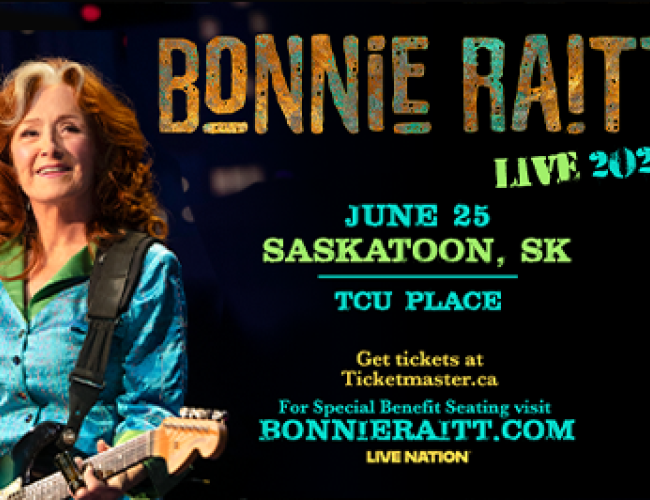 An image of Bonnie Raitt with a guitar. 