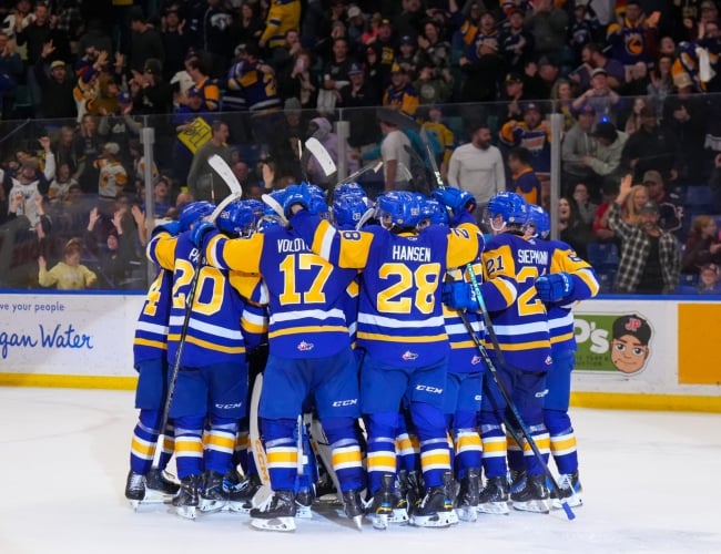 Blades players gathered together after a goal at Sasktel Centre