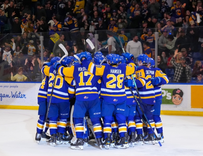 Blades players gathered together after a goal at SaskTel Centre