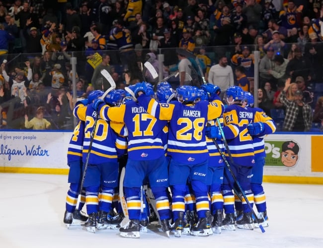 Blades players gathered together after a goal at SaskTel Centre