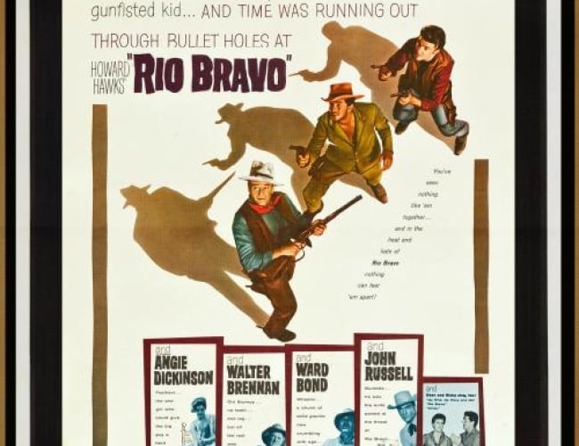 Image of three cowboys with guns looking up and around.