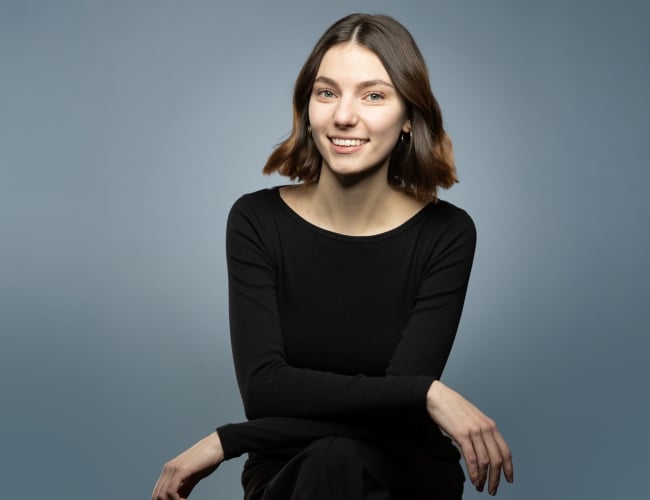 Brooke Nelson Headshot on blue background