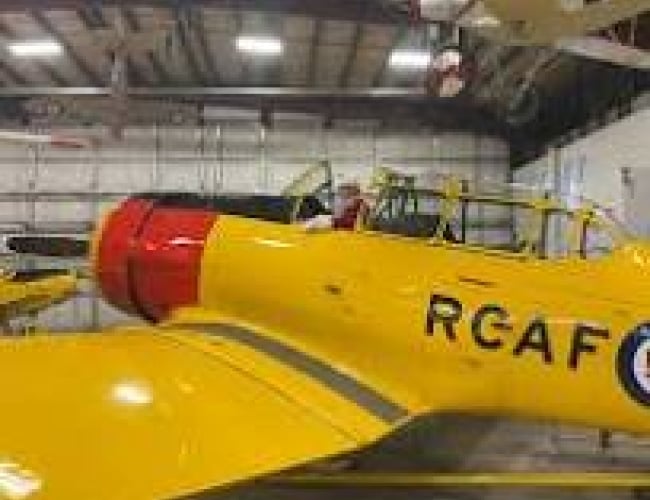 Picture of a person sitting inside the Harvard Aircraft