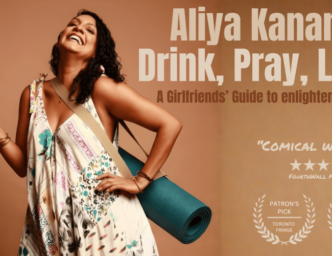 a woman, Aliya Kanani, holding a wine glass with a yoga mat strapped on her back, smiling. 