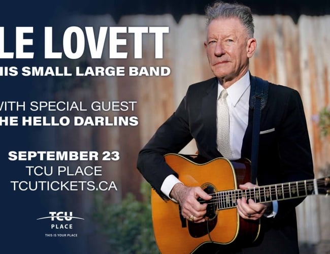 An image of Lyle Lovett holding a guitar.