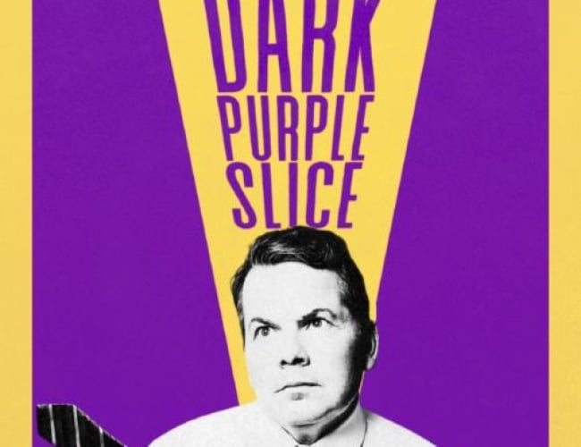 Image of comedian Bruce McCulloch in black and white, wearing a button up shirt and stripped tie, with the tie flying to the side.