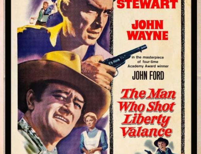 Painted poster of the movie with John Wayne and James Stewart looking intensley in cowboy gear and one of them holding a gun.
