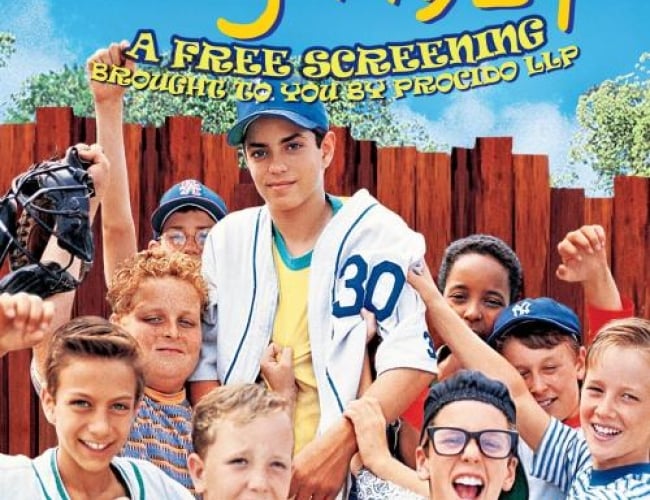 Image of the child actors from the Sandlot, holding up one of the kids and cheering and holding up 