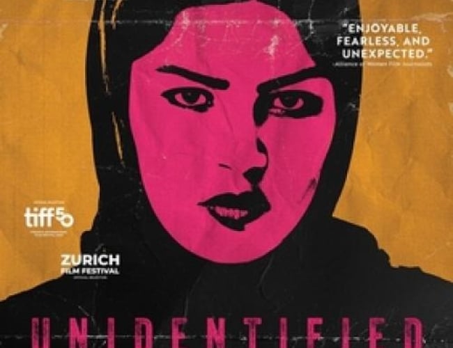 Image of a woman staring at you, in black and pink paint.