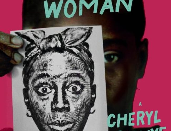 Image of a person holding up a black and white print of a Black woman with eyes wide open, hoop earrings and hair tied in a scarf.