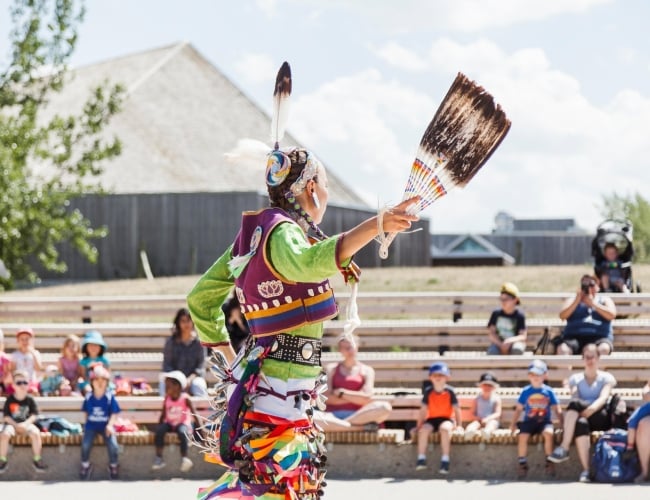 Indigenous Woman Performing Outdoors at Waneskuwin