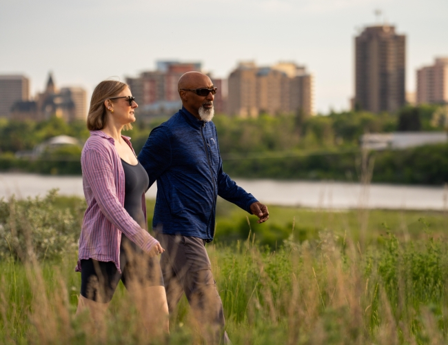 Couple Walking with Skyline Background