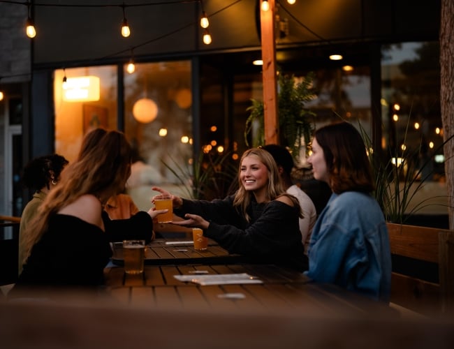 Friends Enjoying Beer and Tacos at Shelter