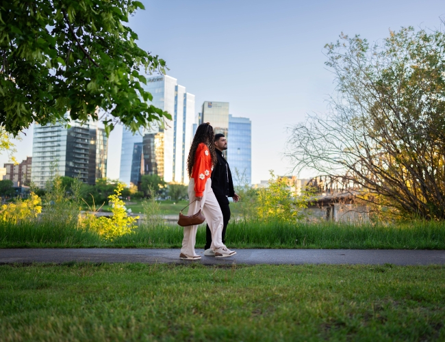 Couple Walking Across from River Landing