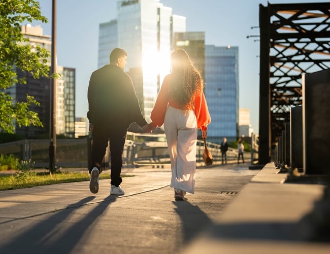 Couple Walking Across Victoria Bridge (Vertical)