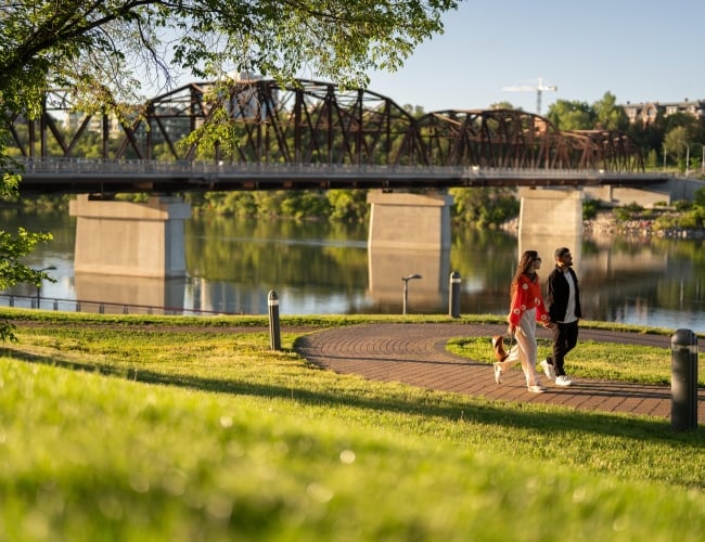 Couple Walking on Path at River Landing