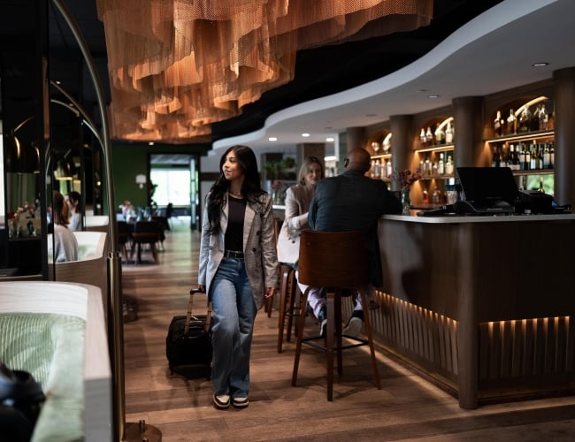 Park Town Visitor Walking Through Bar
