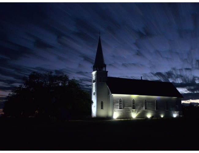 Lights illuminating the historic church at Batoche National Historic Site. 