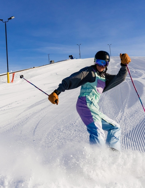 a person downhill skiing