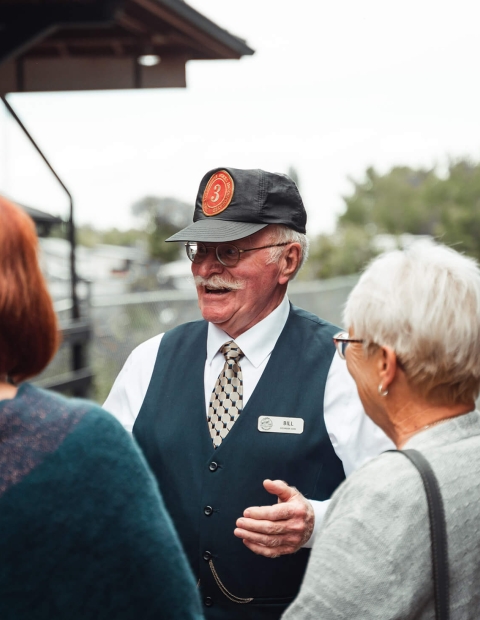 Tour guide speaking to visitors on a tour