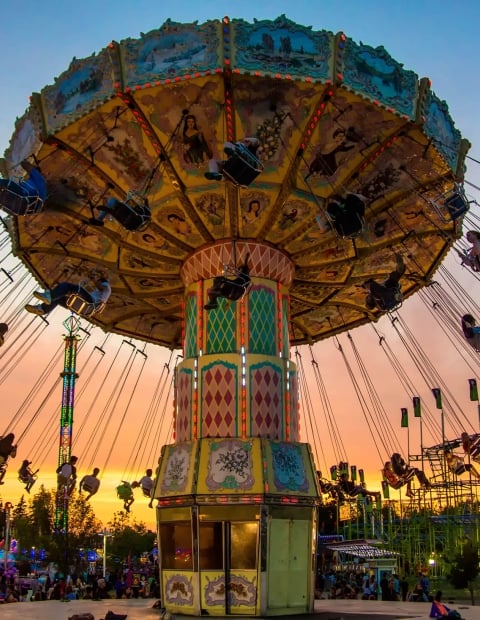 an amusement ride at sunset