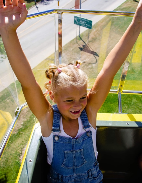 two children on a amusement park ride