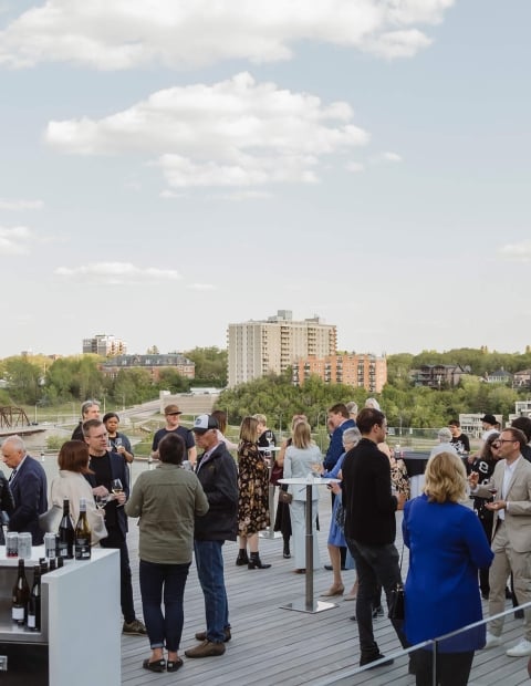 Group of people on a rooftop at a business gathering