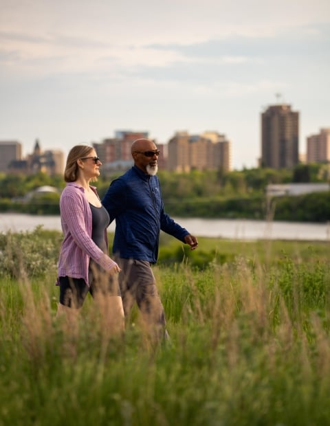 Couple Walking with Skyline Background